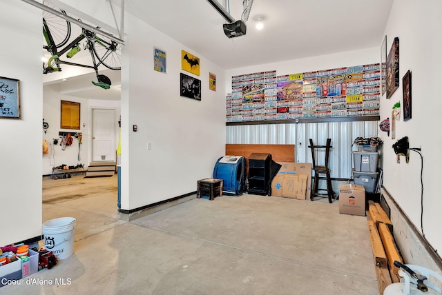 garage featuring baseboards and a garage door opener