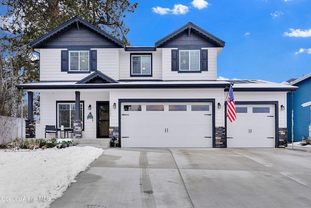 craftsman-style home with a garage and a porch