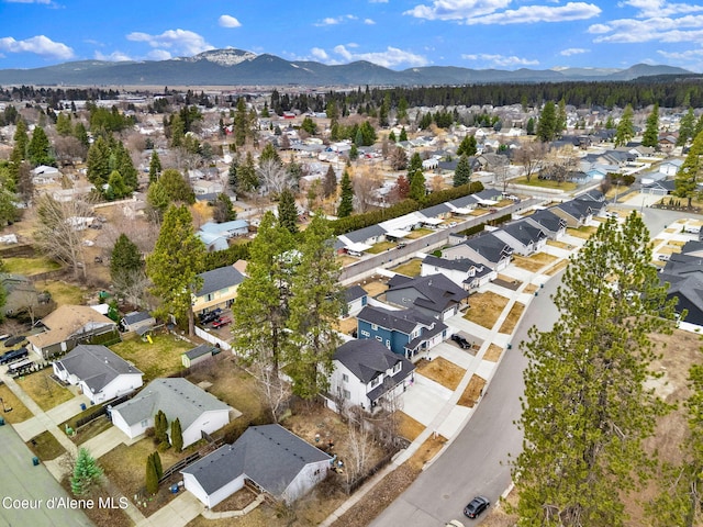 birds eye view of property with a mountain view and a residential view