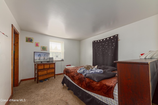 bedroom featuring light carpet