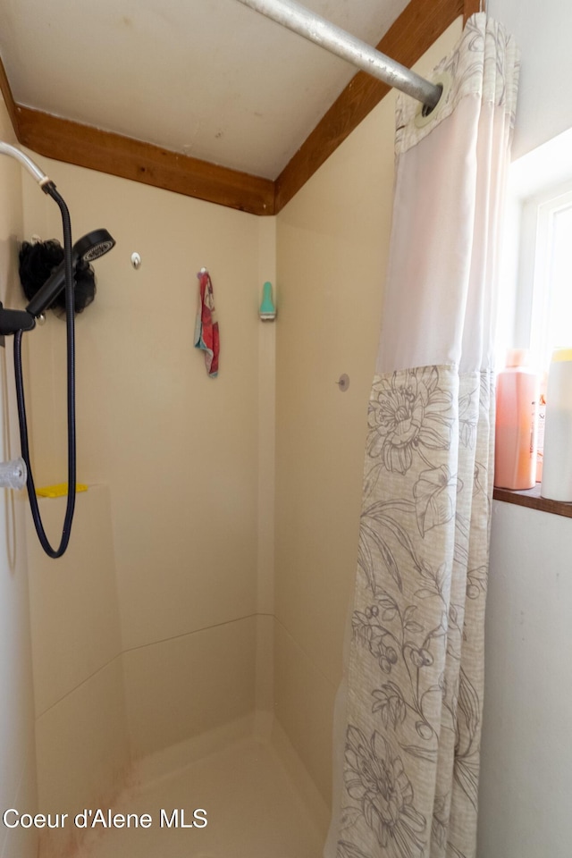 bathroom with a shower with curtain