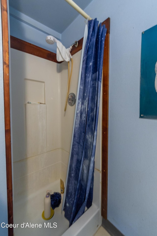 bathroom with a shower with shower curtain