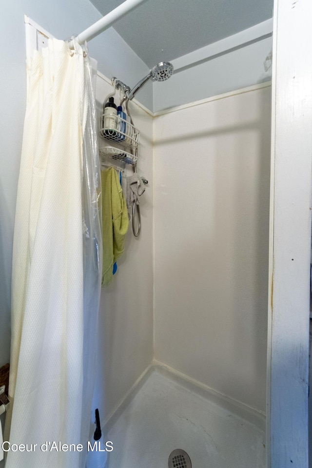 bathroom with a shower with shower curtain