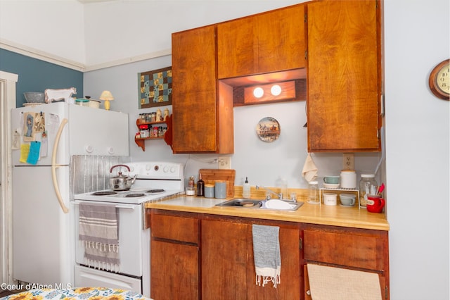 kitchen with white appliances, sink, and tasteful backsplash