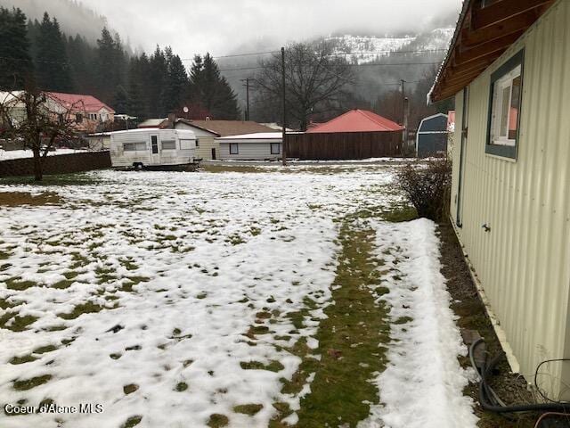 view of yard covered in snow