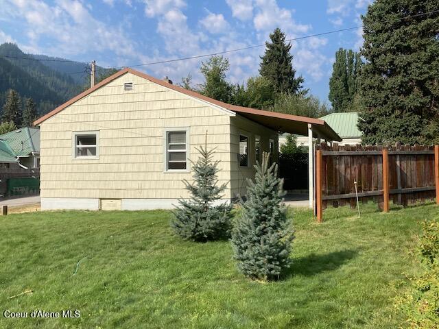 view of property exterior featuring a yard