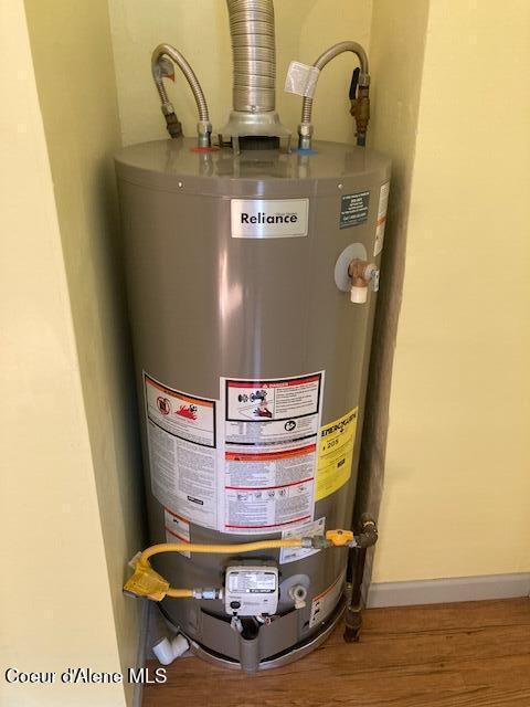 utility room with water heater