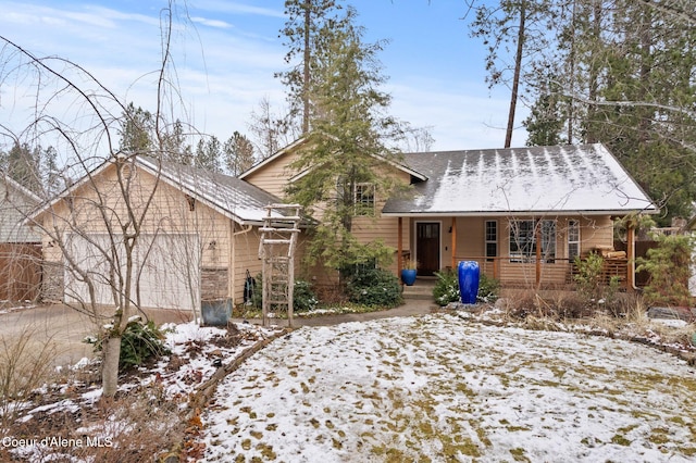 view of front of house featuring a porch and a garage