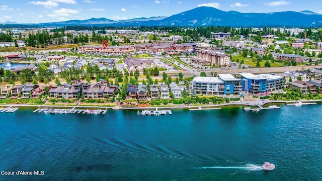 bird's eye view with a water and mountain view