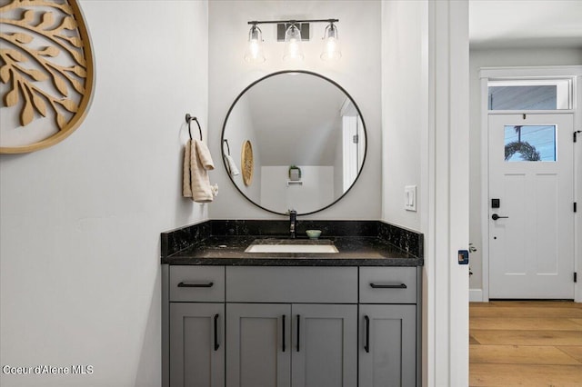 bathroom with vanity and hardwood / wood-style flooring