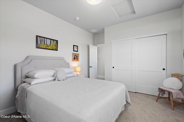 bedroom with a closet and light carpet