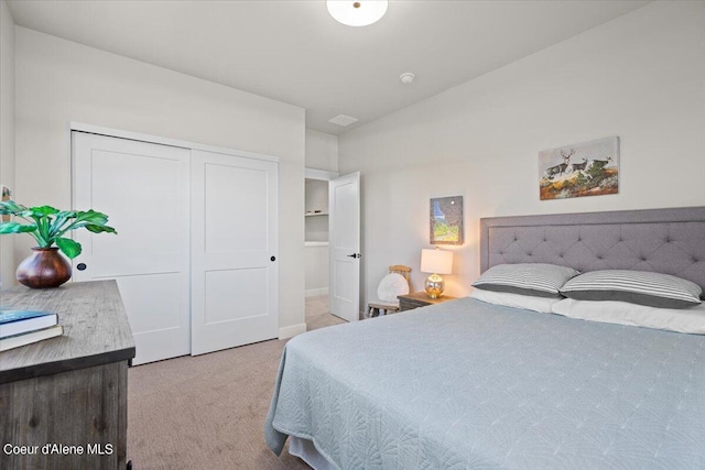 carpeted bedroom featuring a closet