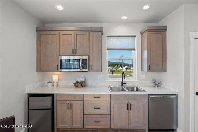 kitchen featuring stainless steel appliances and sink