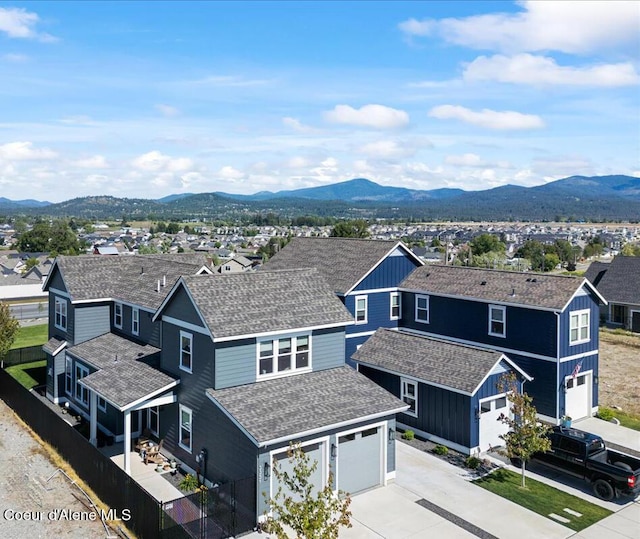 birds eye view of property with a mountain view