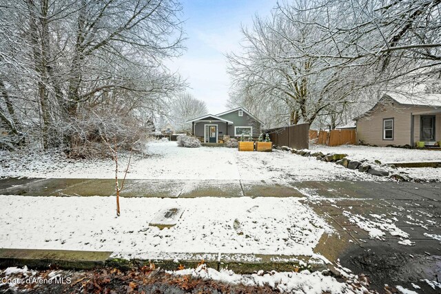 view of yard layered in snow