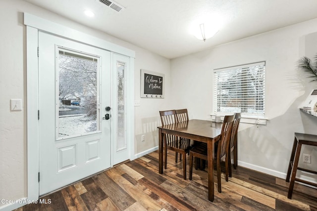 dining room with dark wood-type flooring