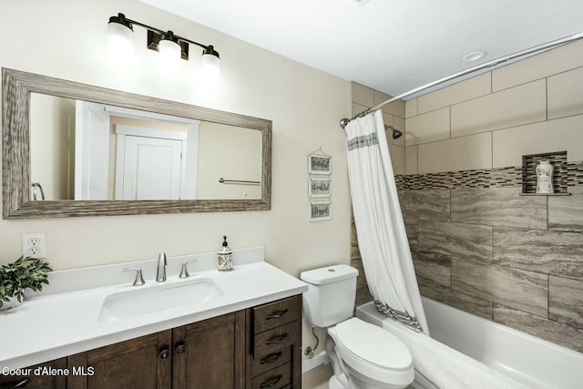 full bathroom featuring toilet, vanity, and shower / bathtub combination with curtain