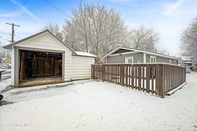 view of snow covered garage