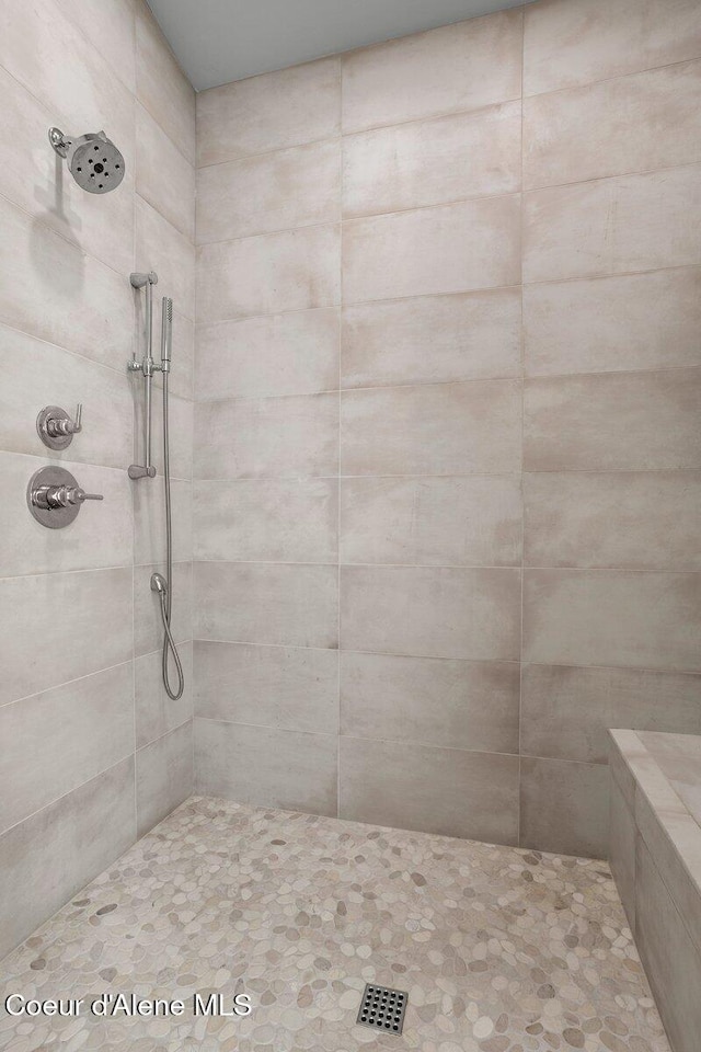 bathroom with a tile shower