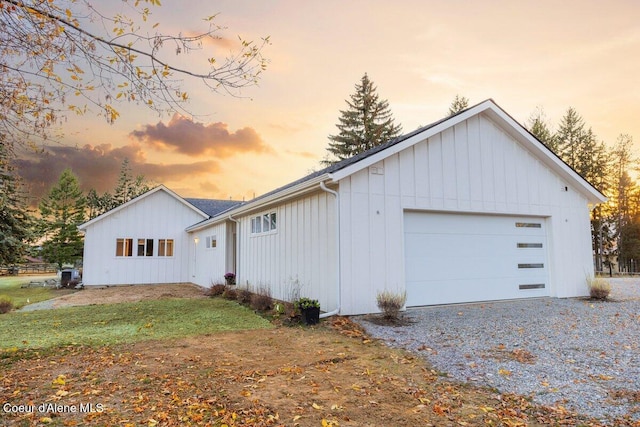 property exterior at dusk with a garage