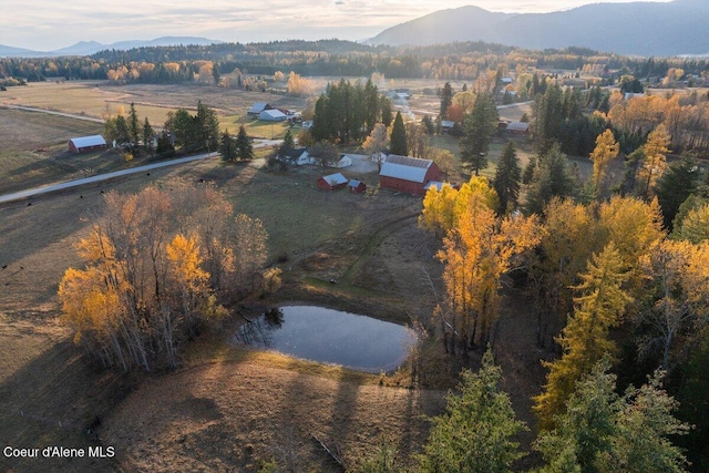 bird's eye view with a water and mountain view