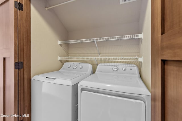 laundry room featuring washing machine and dryer