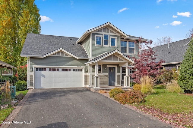 craftsman house with a garage