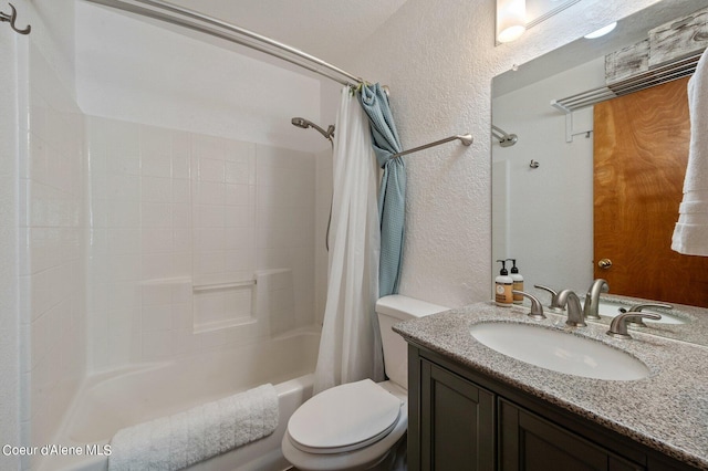 full bathroom with vanity, shower / bath combo with shower curtain, and toilet