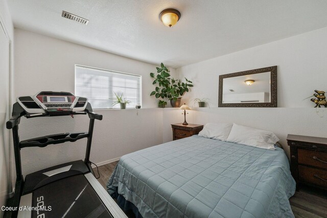 bedroom featuring wood-type flooring