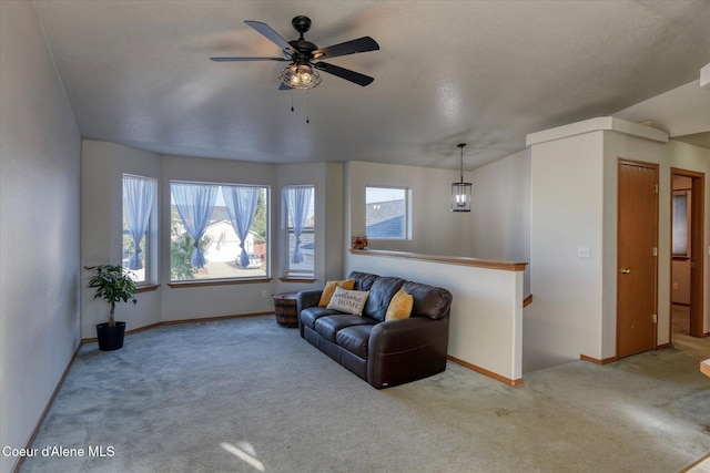 living room featuring ceiling fan and carpet floors