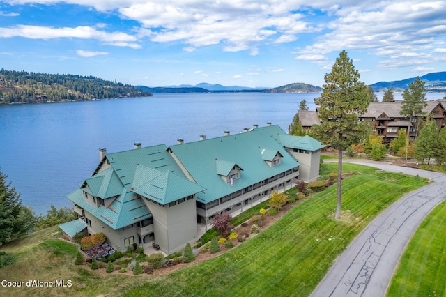 drone / aerial view featuring a water and mountain view