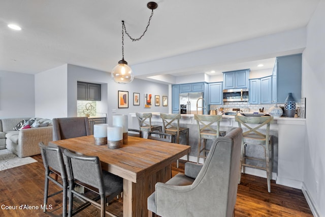 dining space featuring dark hardwood / wood-style floors