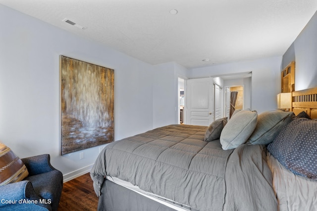 bedroom featuring dark wood-type flooring