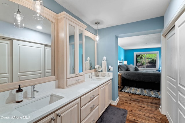 bathroom featuring hardwood / wood-style floors and vanity