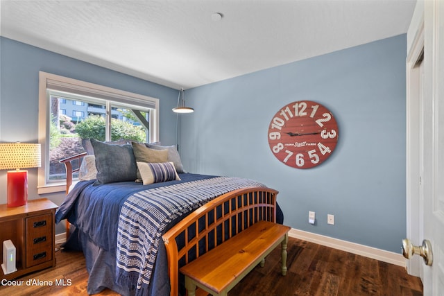 bedroom featuring dark hardwood / wood-style flooring