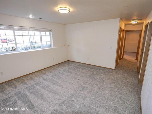 unfurnished room with carpet floors