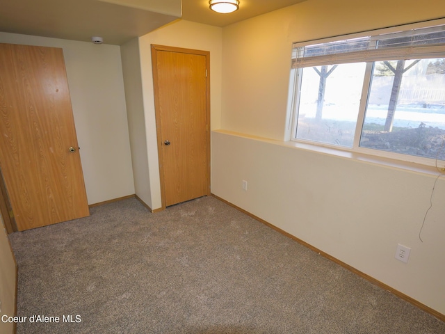 unfurnished bedroom with carpet floors and a closet