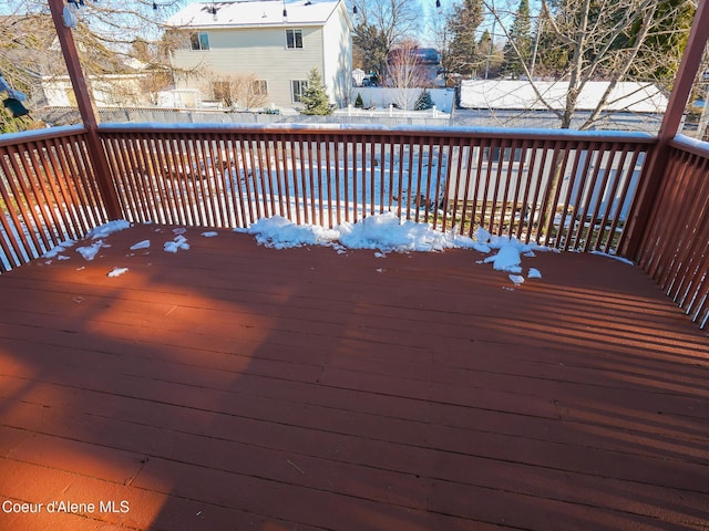 view of snow covered deck