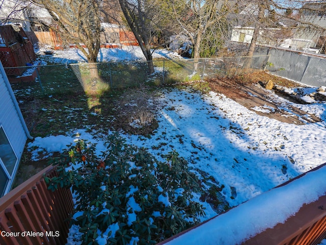 view of yard covered in snow