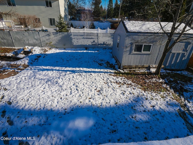 view of yard layered in snow