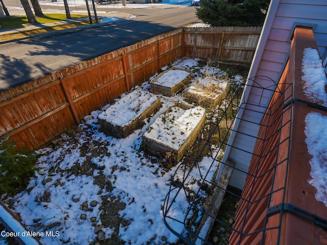 view of yard layered in snow