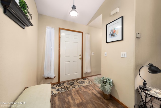 entryway featuring hardwood / wood-style flooring and vaulted ceiling