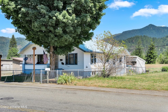 view of front of home featuring a mountain view