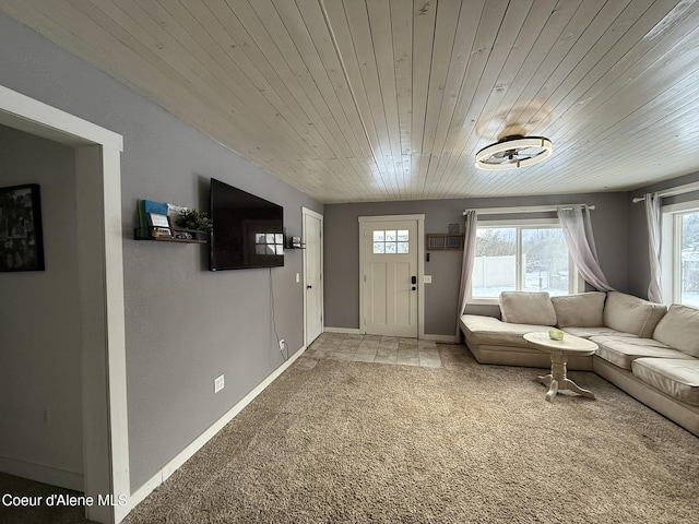 unfurnished living room with wood ceiling and carpet floors