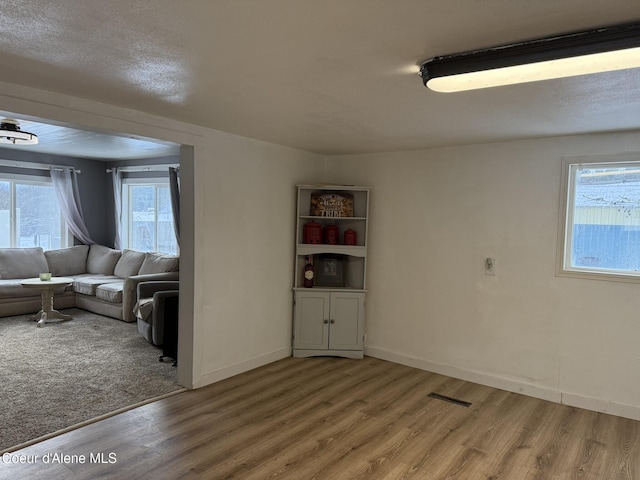 unfurnished living room featuring hardwood / wood-style flooring