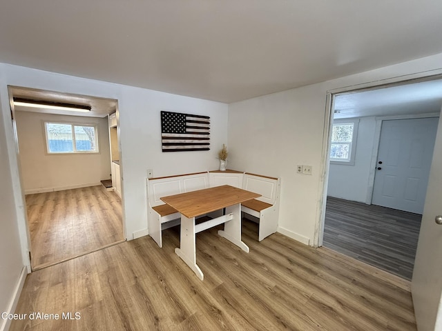 dining space with a healthy amount of sunlight and light wood-type flooring