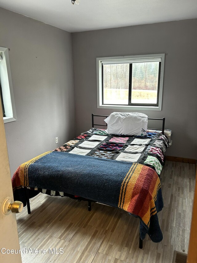 bedroom featuring hardwood / wood-style flooring