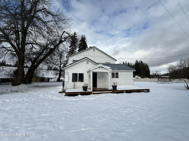 view of front of property with a wooden deck