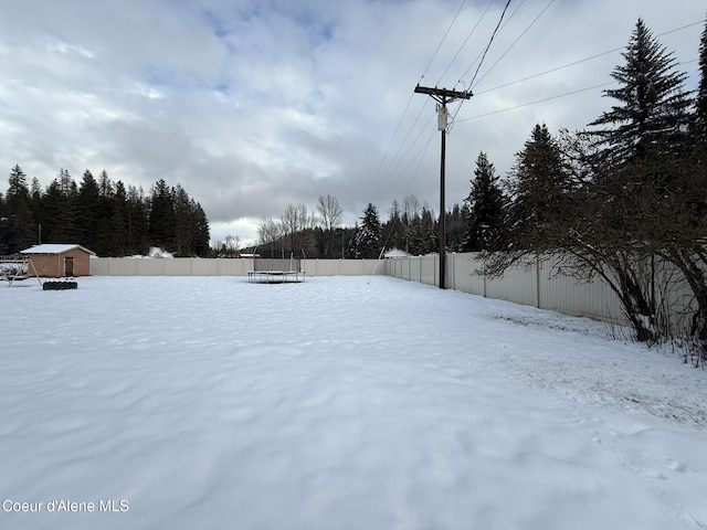 view of yard layered in snow