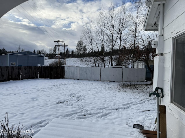 view of yard covered in snow